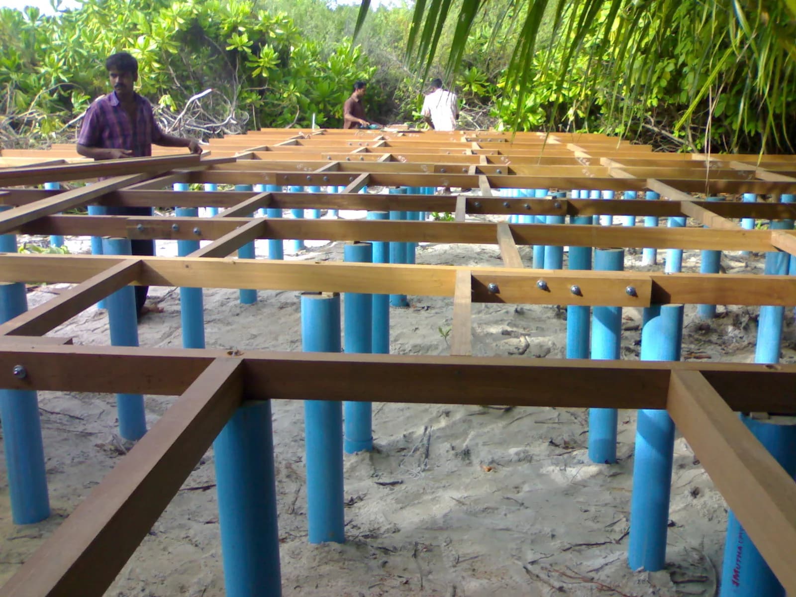 Timber deck under construction on painted piles at Ethere Madivaru