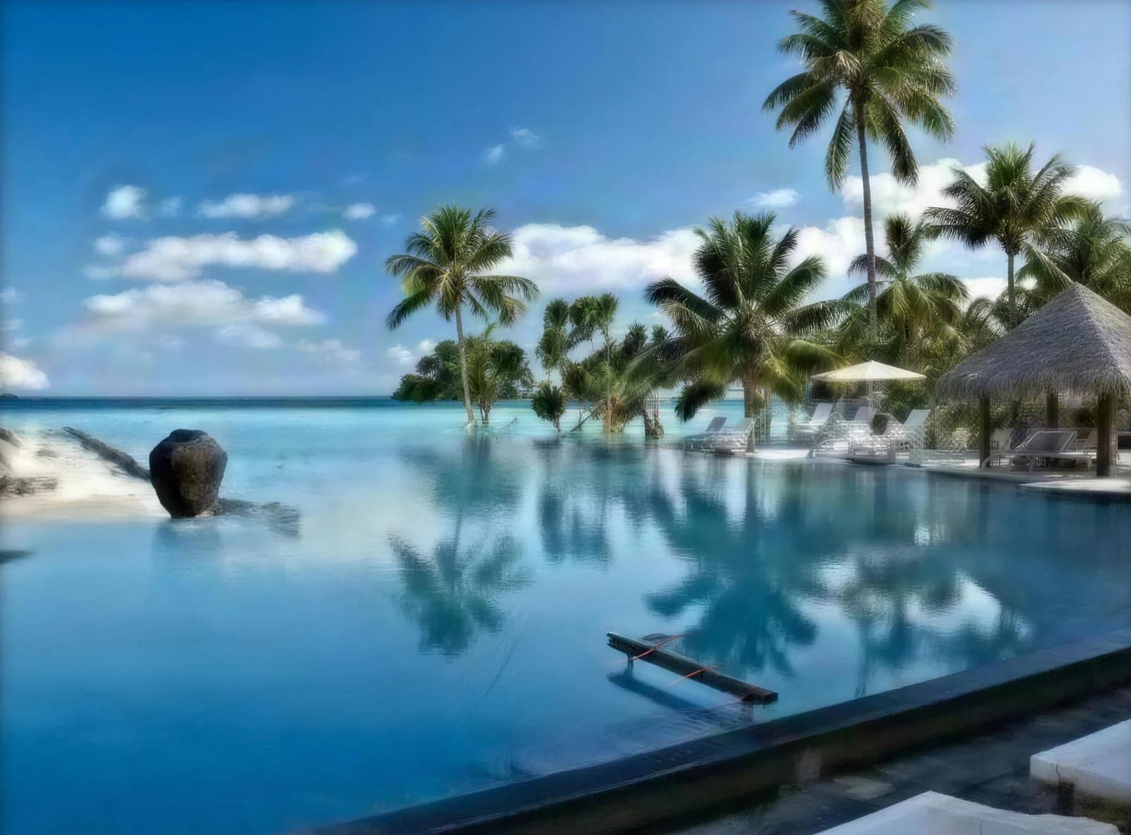Completed pool bar and infinity pool at Coco Palm Boduhithi