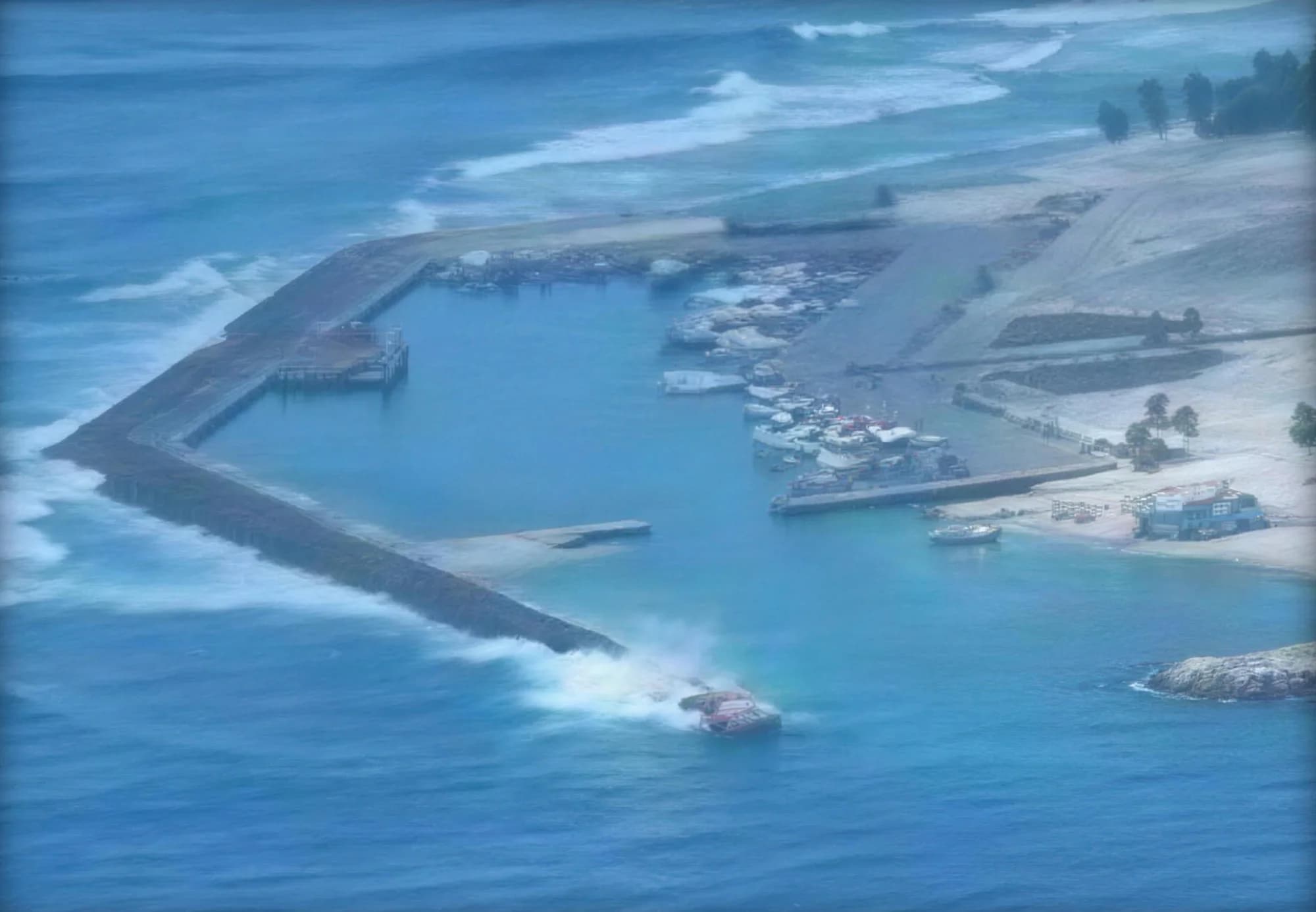 Aerial view of a completed harbour and breakwater at Fuvahmulah
